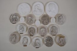 A collection of plaster intaglios, largest 3" x 2"