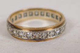 A 9ct gold eternity ring set with white stones, size P/Q, 2.9g