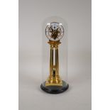 A brass fusee skeleton clock with enamelled dial and Arabic numerals, under a glass dome, 12" high