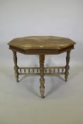 A Victorian beechwood octagonal top centre table, raised on carved twisted supports, united by