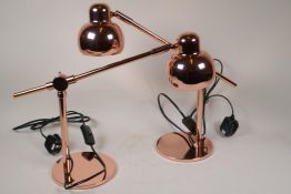A pair of copper finish anglepoise style table lamps, 15" high