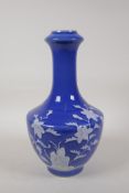 A blue glazed porcelain vase with raised enamel floral decoration, Chinese Qianlong seal mark to