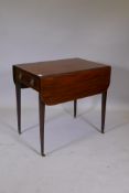 A Georgian mahagony Pembroke table with boxwood strung inlay, original brass handles and single