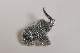 A sterling silver elephant brooch set with marcasite, 1"