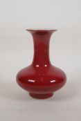 A Chinese sang de boeuf glazed porcelain vase of squat form, 5½" high