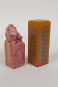 A Chinese amber soapstone seal with character inscription decoration, and another soapstone seal