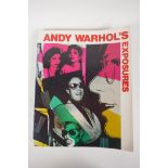 One volume, Andy Warhol's 'Exposures', featuring photographs of celebrities from the 1970s,