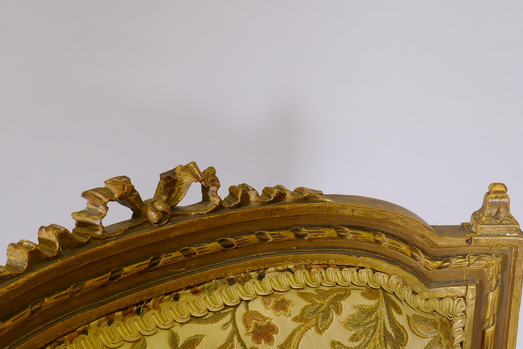 An antique French giltwood open armchair, the shaped back with carved and pierced detail, raised - Image 2 of 4