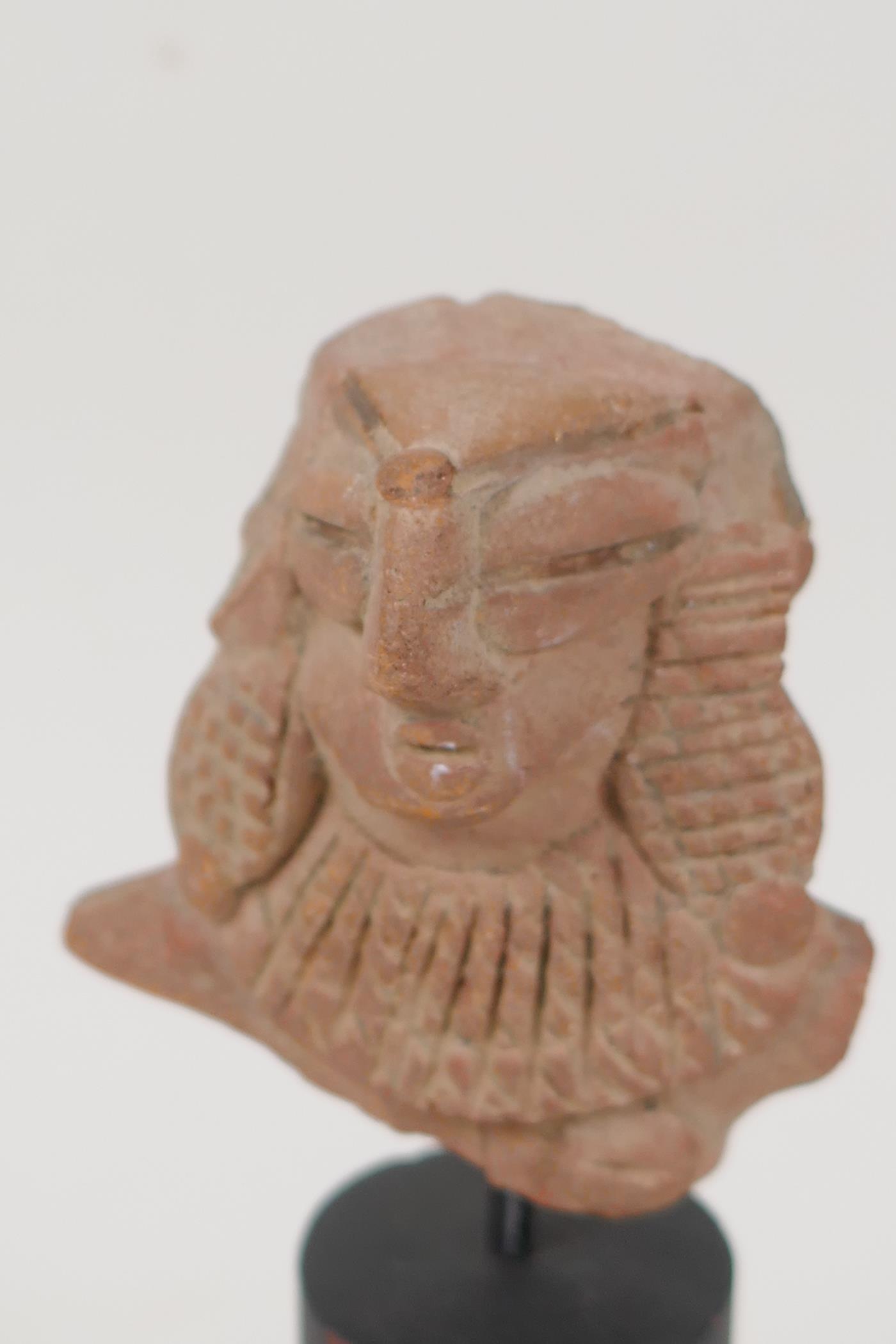 An Eastern terracotta head, 3" long, on turned stand - Image 2 of 3