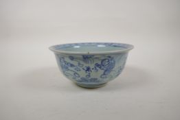 A Chinese blue and white porcelain rice bowl, decorated with boys playing in a garden, 5½" diameter