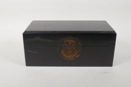 A Chinese ebonised hardwood box with a brass lock, 10" x 5", 4½" high