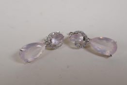 A pair of silver and cubic zirconia earrings with rose quartz drops, 1" drop