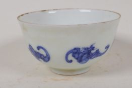 A Chinese blue and white porcelain teabowl decorated with bats, 6 character mark to base, 3"