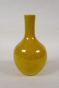 A Chinese yellow glazed porcelain bottle vase, 4 character mark to base, 6½" high