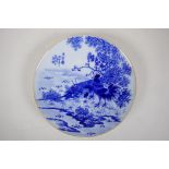 A Chinese blue and white porcelain cabinet plate decorated with cockerels on a riverbank,