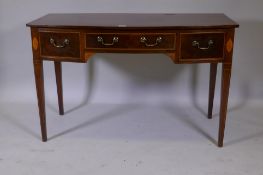 A C19th mahogany bowfront side/writing table with three drawers and inlaid decoration, raised on
