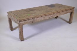 A Chinese hardwood low table with carved frieze, late C19th/early C20th, 54" x 22" x 16"