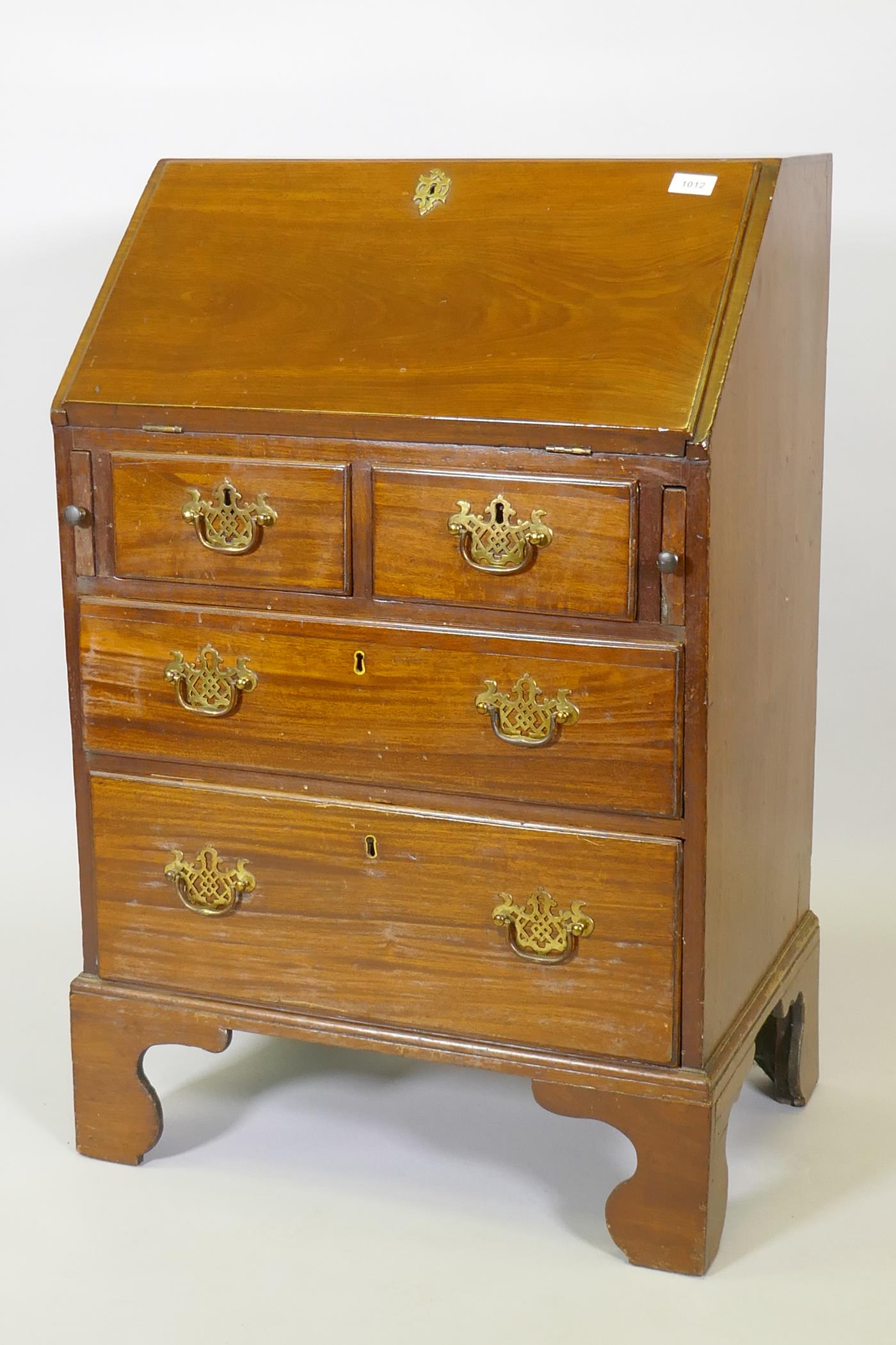 A Georgian style mahogany fall front bureau of small proportions, with two short over two long