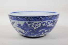 A Ming style blue and white porcelain bowl with dragon decoration, Chinese Xuande 6 character mark