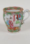 A C19th Chinese Canton porcelain tea cup painted with figures, 3" high