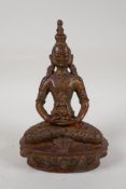 A Sino Tibetan gilt bronze figure of Buddha seated in meditation, 7½" high