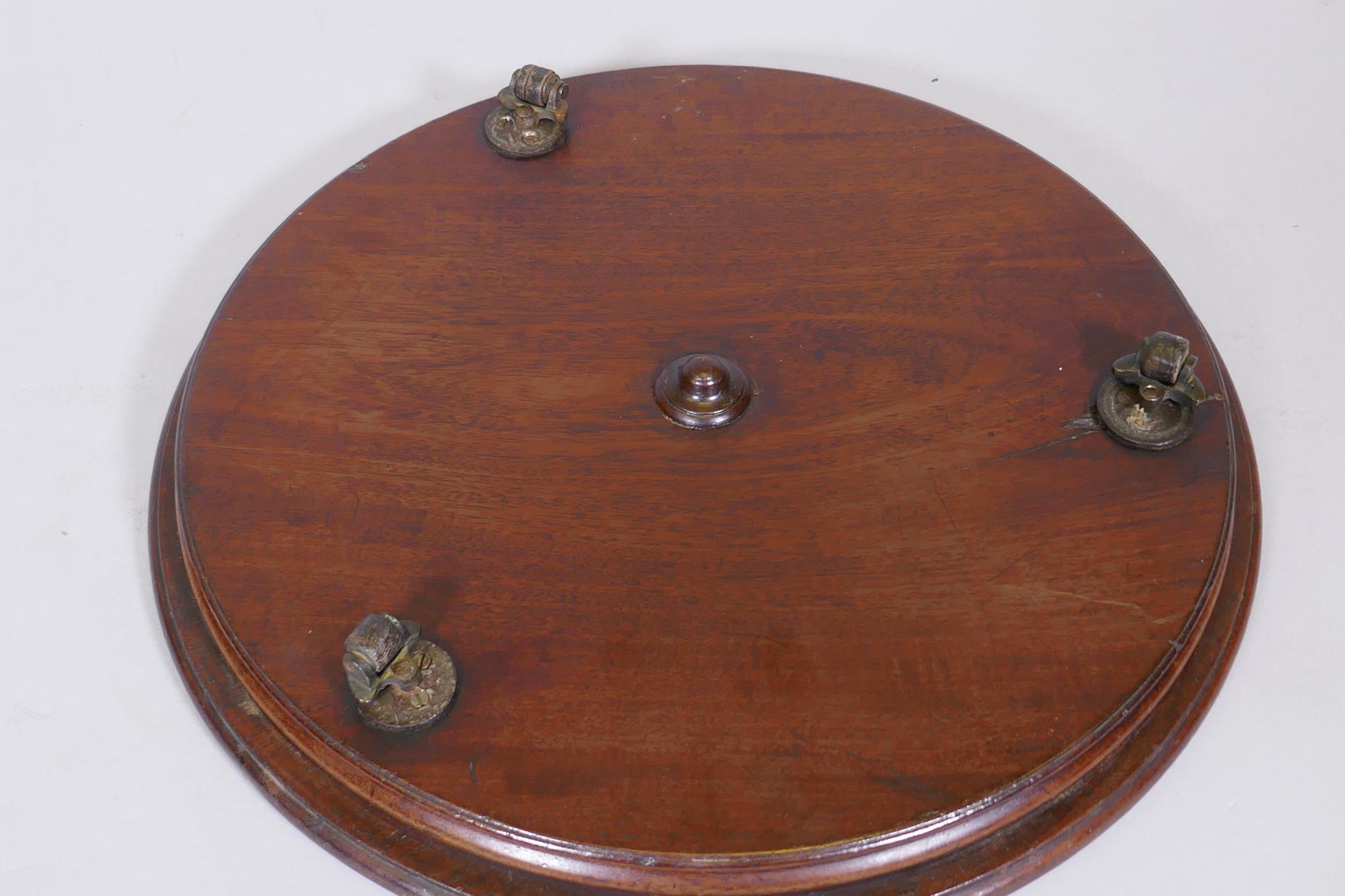 A mahogany revolving table stand, fitted with three brass and leather castors, 15" diameter - Image 3 of 4