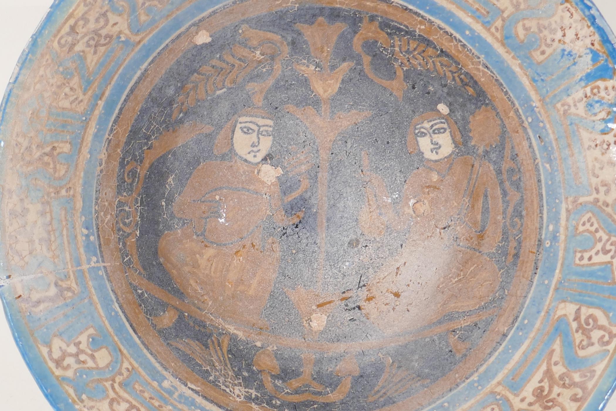 A Persian earthenware bowl decorated with figures in a garden, 9½" diameter - Image 2 of 5