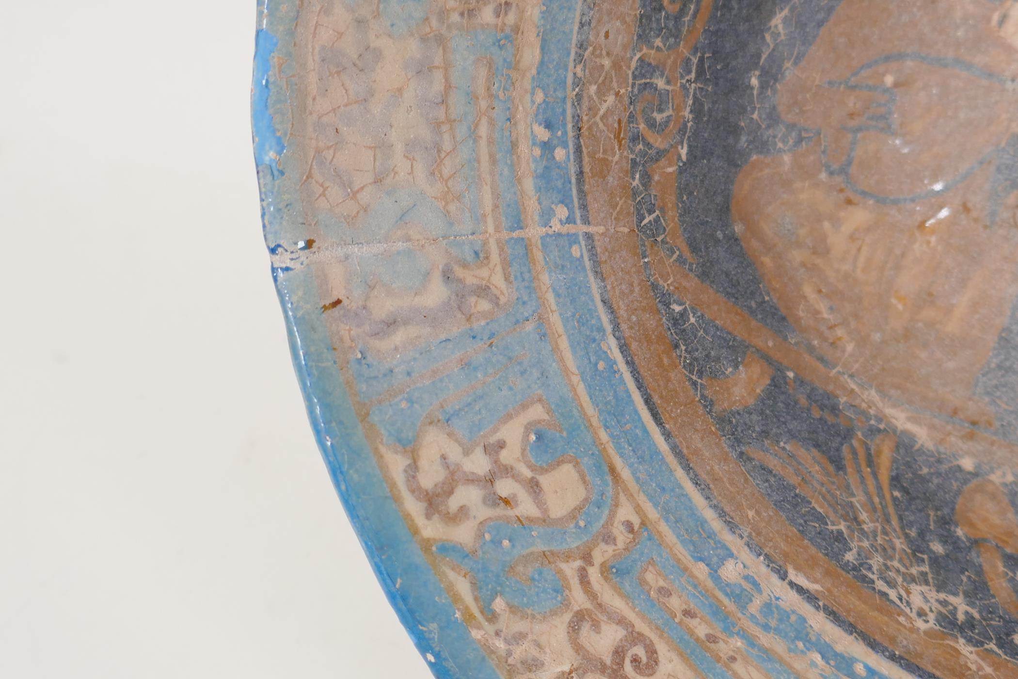 A Persian earthenware bowl decorated with figures in a garden, 9½" diameter - Image 3 of 5