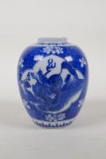 A blue and white porcelain ginger jar with decorative panels depicting kylin on a cracked ice and
