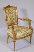 An antique French giltwood open armchair, the shaped back with carved and pierced detail, raised