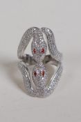 A 925 silver and cubic zirconia set twin snake ring with ruby set eyes, size O/N