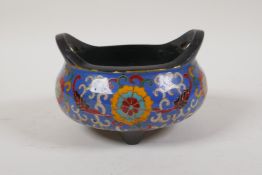 A Chinese cloisonne enamelled bronze censer with two phoenix eye handles and tripod supports,