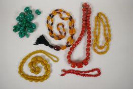 Six vintage costume jewellery necklaces including amber and coral style, longest 42"