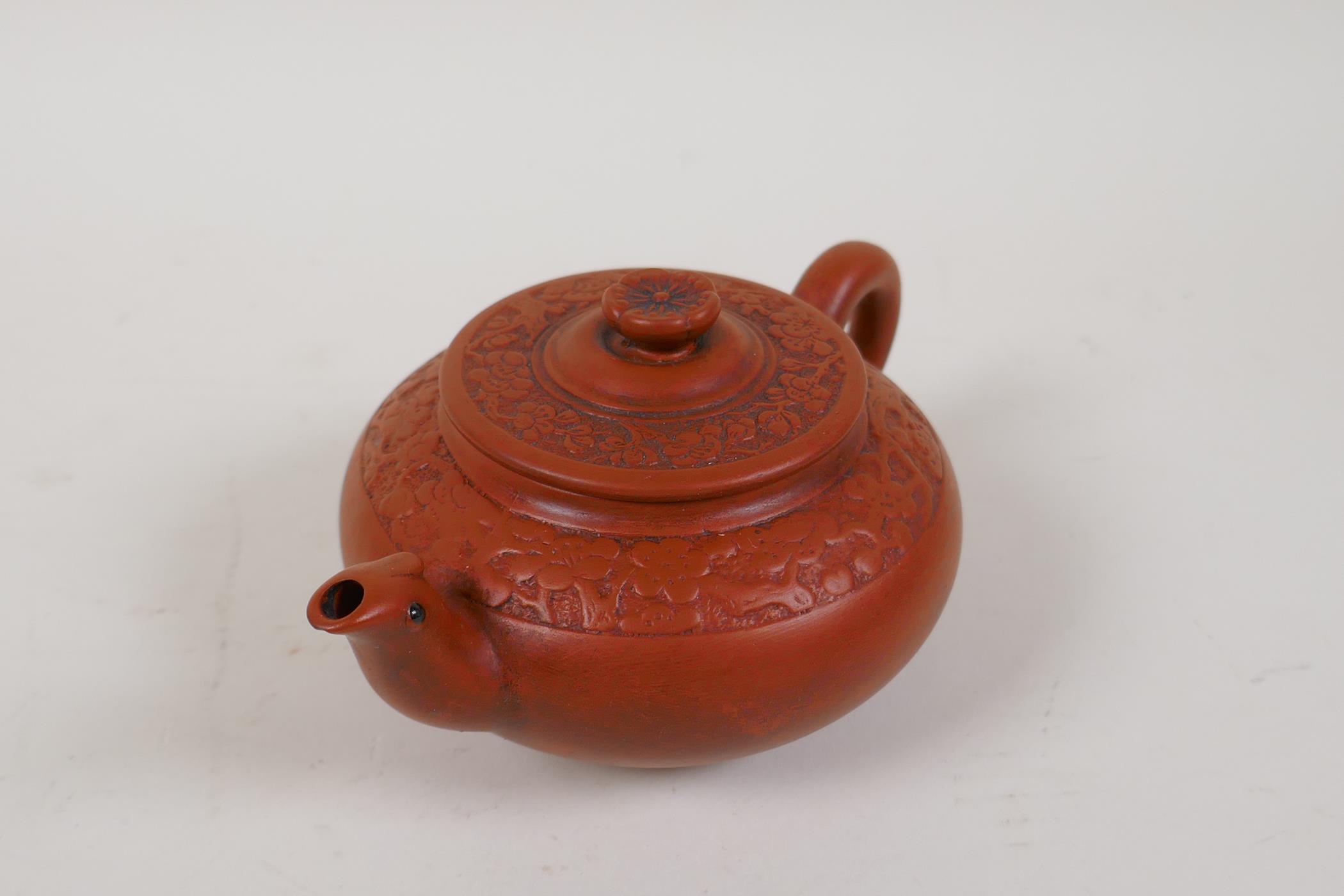 A Chinese YiXing tea pot with moulded prunus blossom decoration, impressed mark to base, 4" diameter - Image 2 of 4