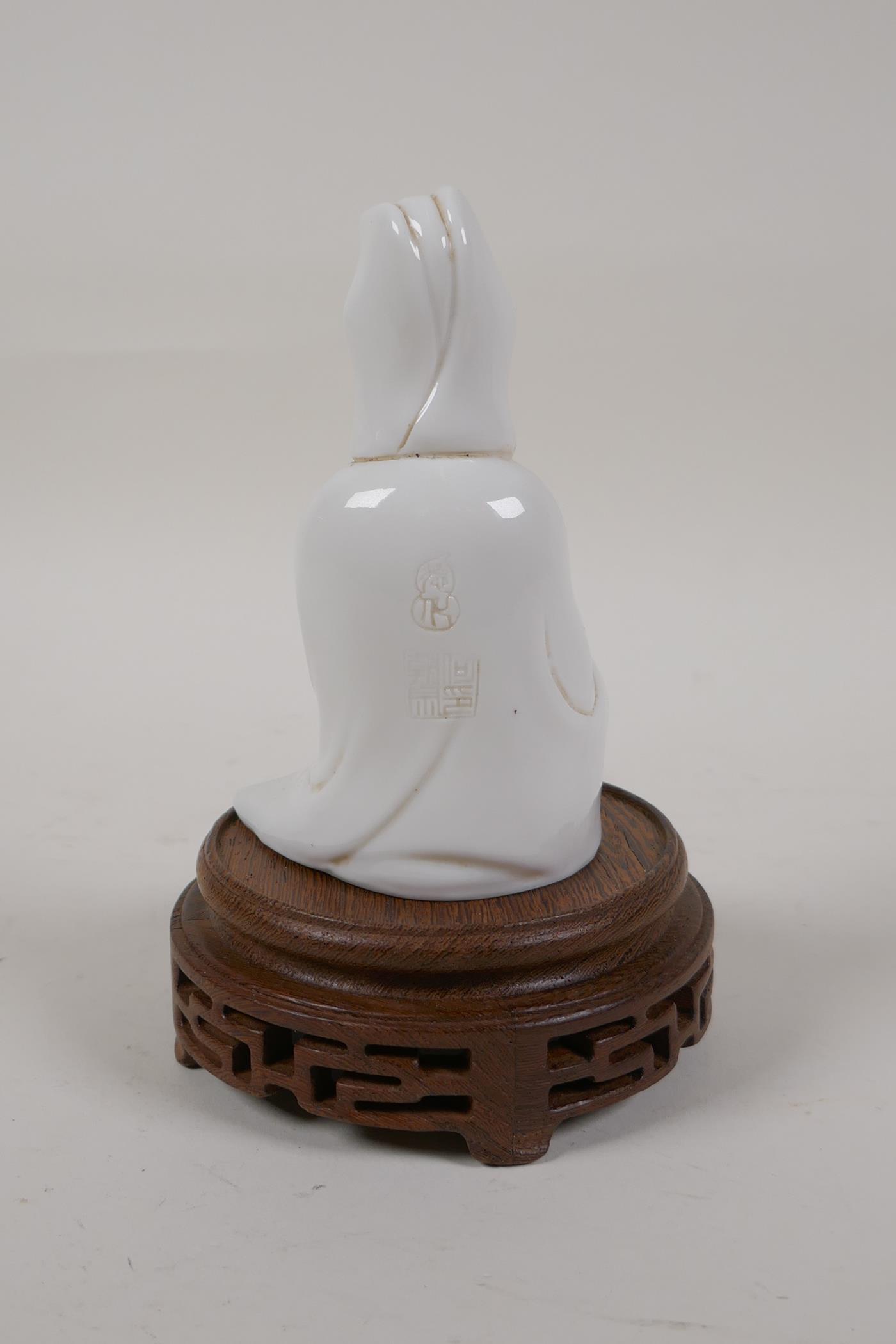 A Chinese blanc de chine porcelain Quan Yin, on a turned and pierced hardwood stand, impressed marks - Image 2 of 4
