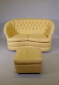 A tub shaped button back two seater settee, with shaped front and matching footstool, 58" wide