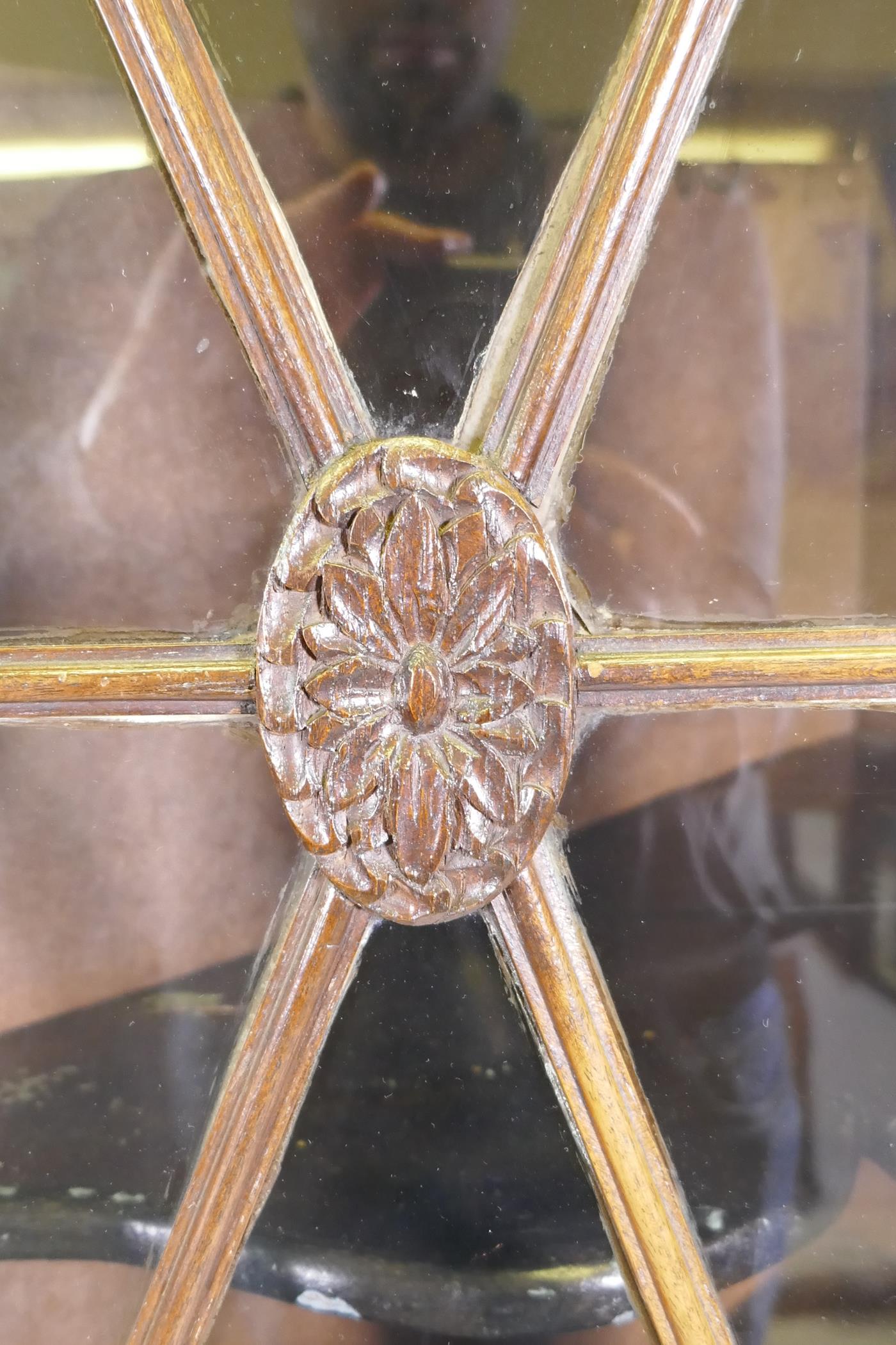 An antique oak corner cabinet with two glazed doors over two doors with carved panels, adapted, - Image 4 of 5