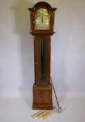 A mahogany cased long case clock with Roman numerals to the chapter dial, the German movement