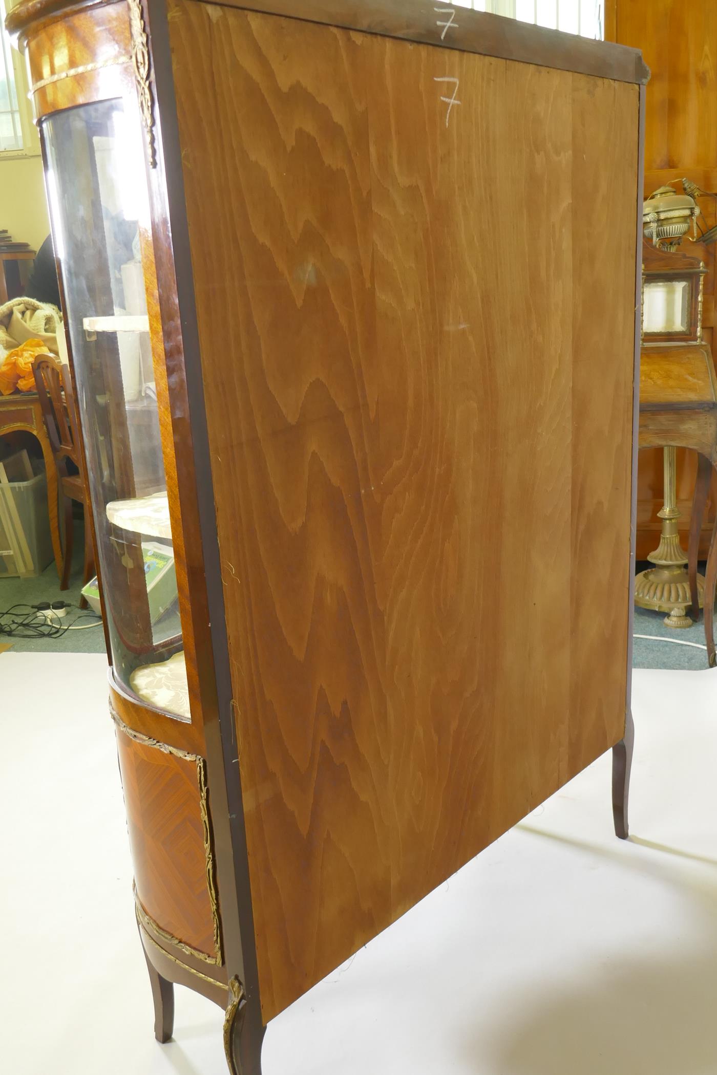 A French marquetry inlaid mahogany serpentine front vitrine with brass mounts, the interior with - Image 6 of 6