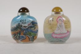 A Chinese reverse decorated glass snuff bottle depicting the great wall and a portrait of a noble,