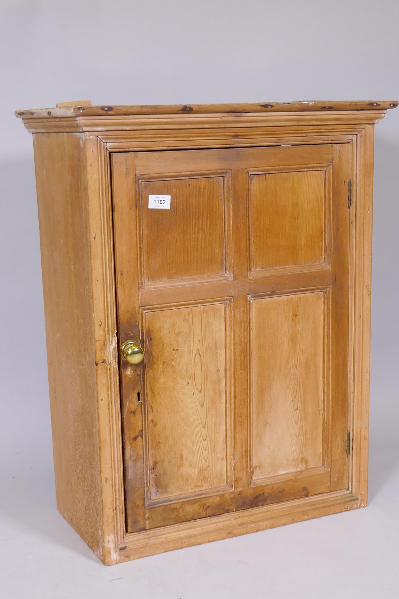A C19th pine hanging food cupboard with panelled door and two shelves, 24" x 12" x 30" - Image 2 of 3