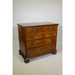 An C18th Georgian walnut chest of two over three drawers, later mahogany top and brass ring handles,