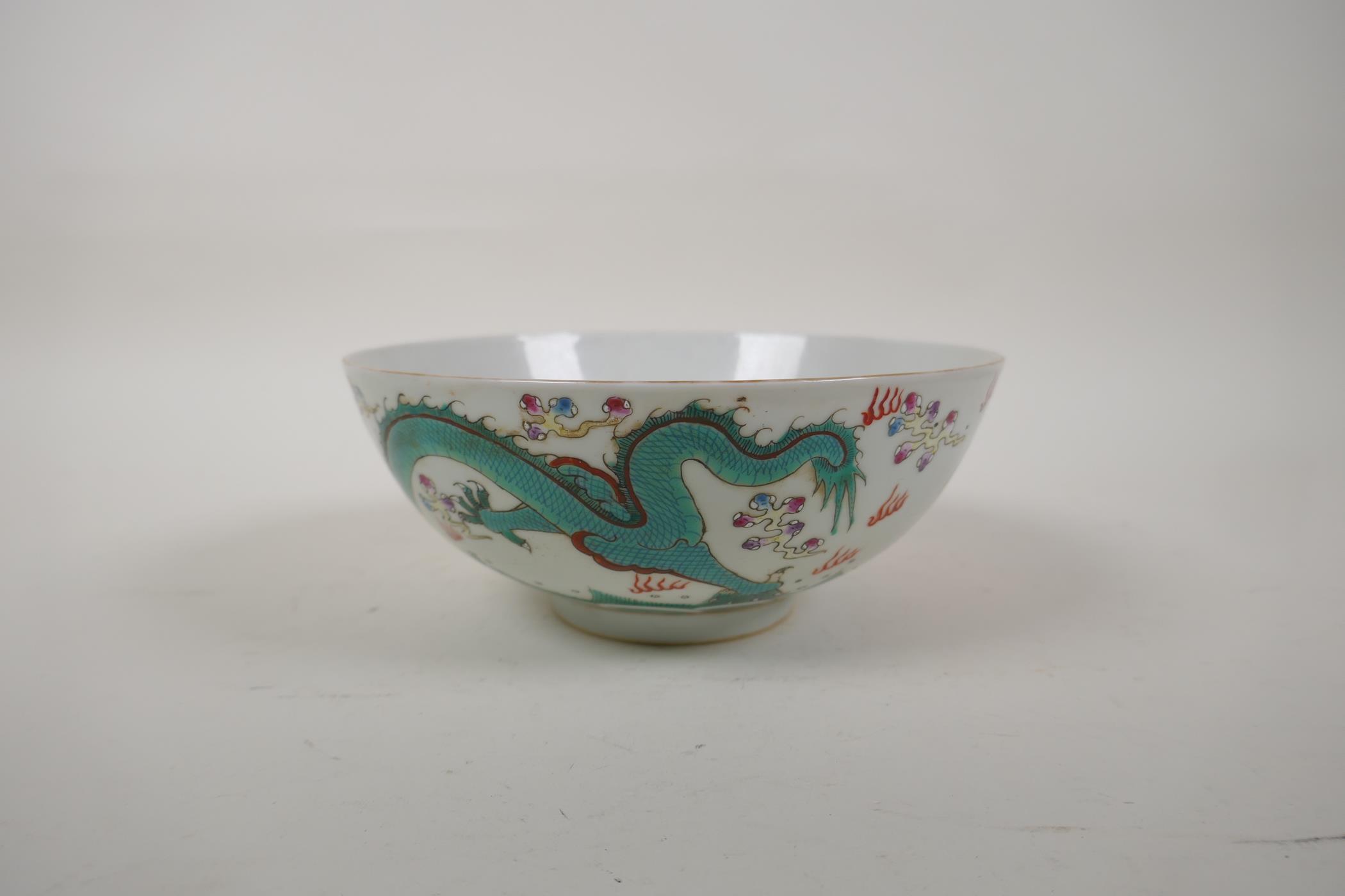A polychrome porcelain bowl decorated with an iron red and green dragon chasing the flaming pearl, - Image 8 of 14