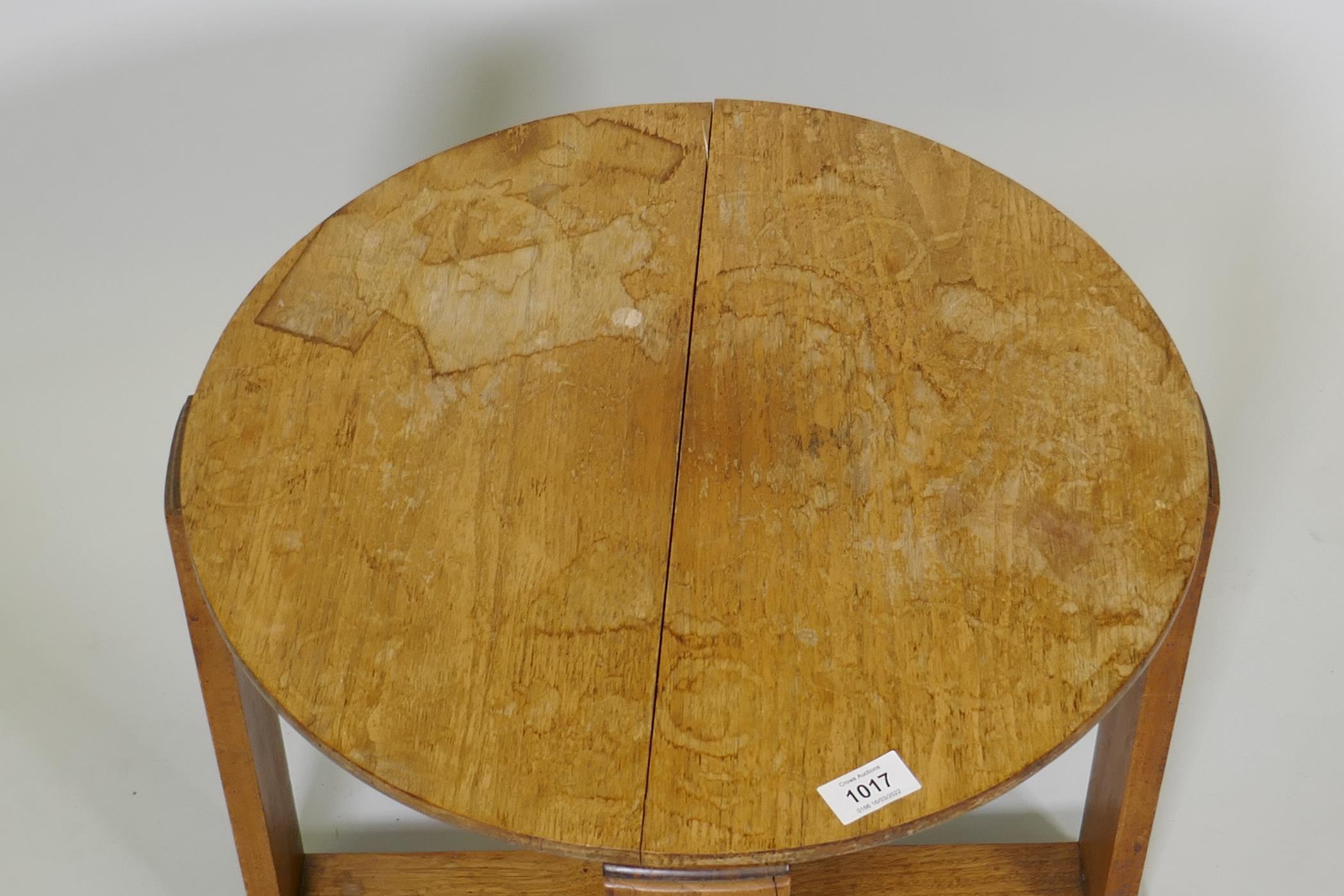 An Art Deco mahogany occasional table on plank supports and cross stretcher, 16½" x 19" diameter - Image 4 of 5