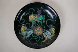 A famille noir porcelain charger with kylin decoration, Chinese Kangxi 6 character mark to base, 11"