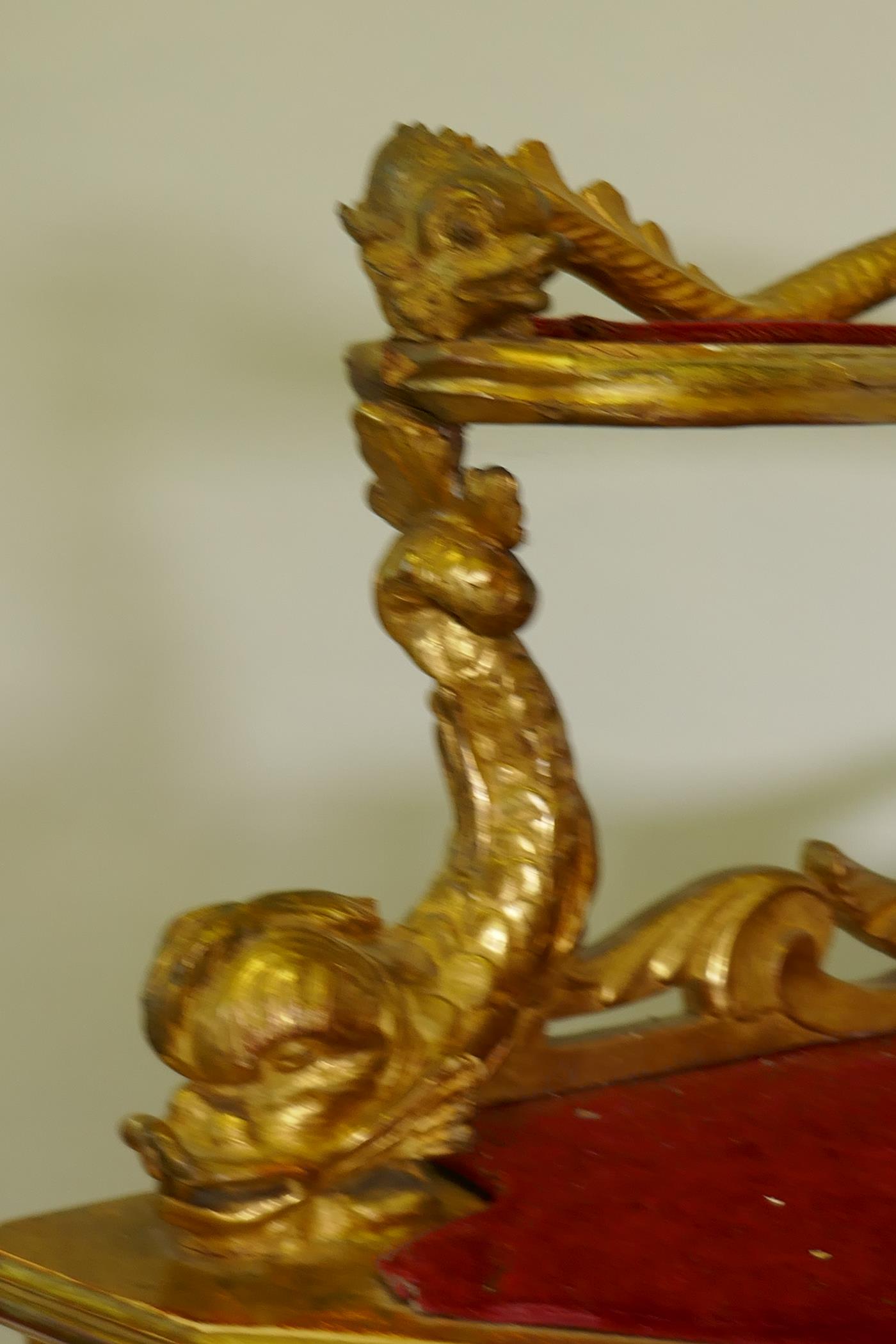 A C19th Italian giltwood corner cabinet, the top with an open shelf supported by dolphins, the - Image 4 of 11