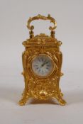 A gilt brass miniature carriage clock in the rococo style, 3" high