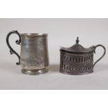A hallmarked silver tankard with fine engraved decoration, Exeter 1857, 89g, and a hallmarked silver