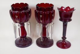 A near pair of C19th ruby glass lustres, lustre drops incomplete, and another ruby glass lustre,