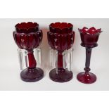 A near pair of C19th ruby glass lustres, lustre drops incomplete, and another ruby glass lustre,